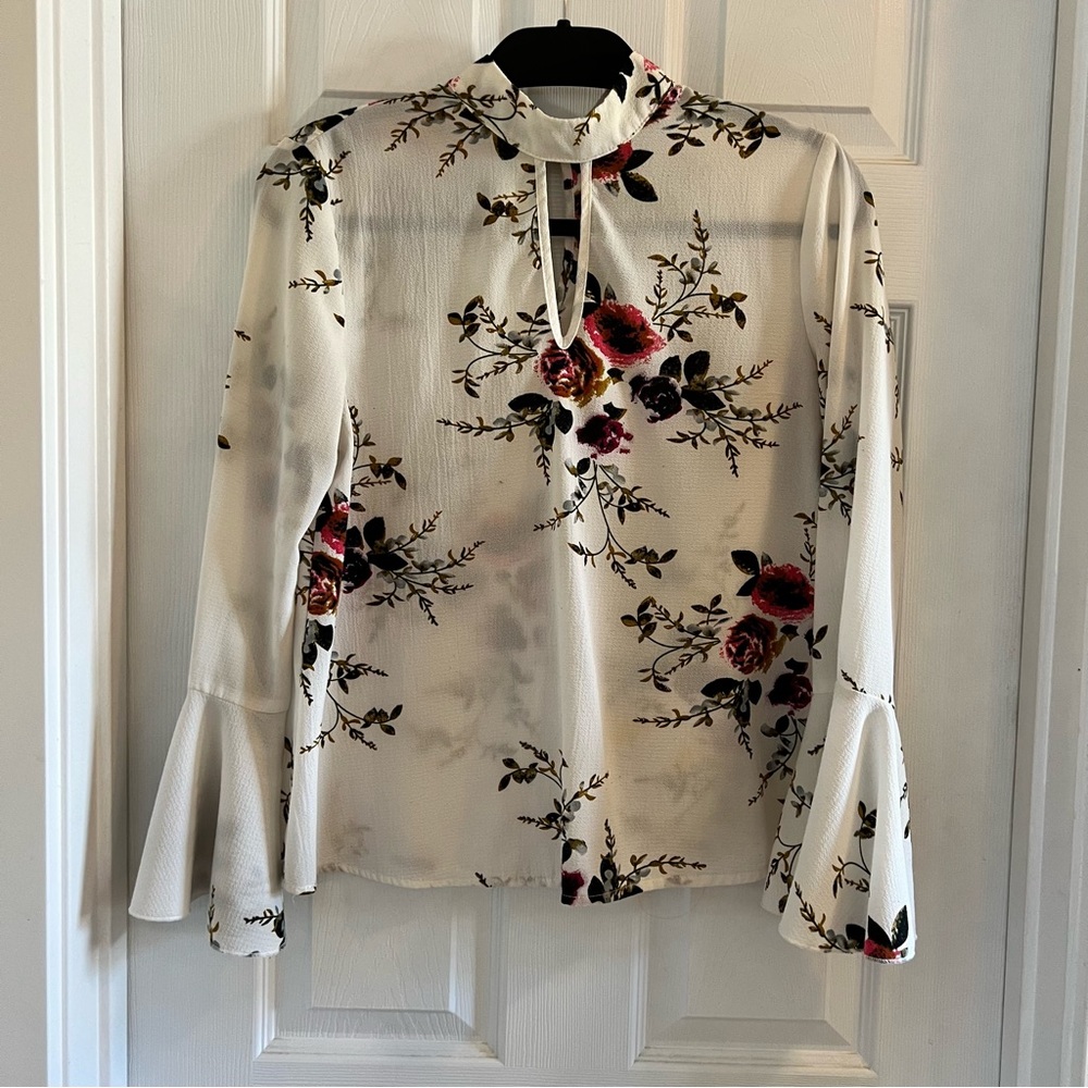 She in bell sleeved floral high neck blouse